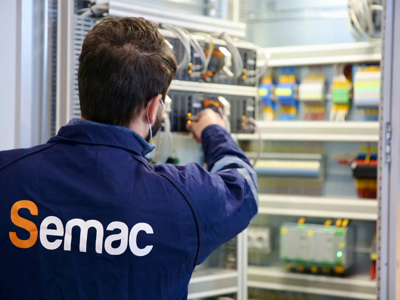 SEMAC Automation engineer working on a process automation control panel